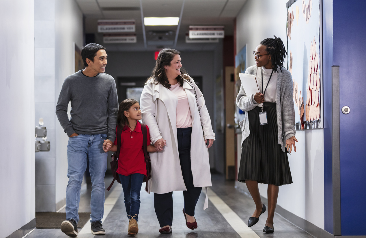teacher speaks with parents
